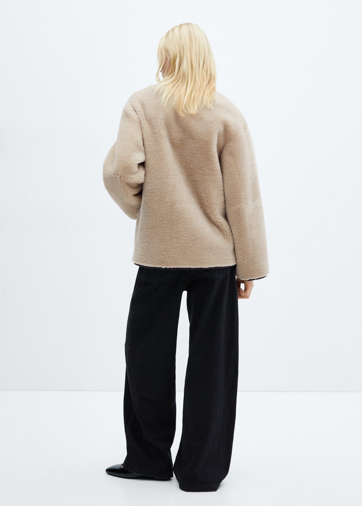 Faux fur coat with applications